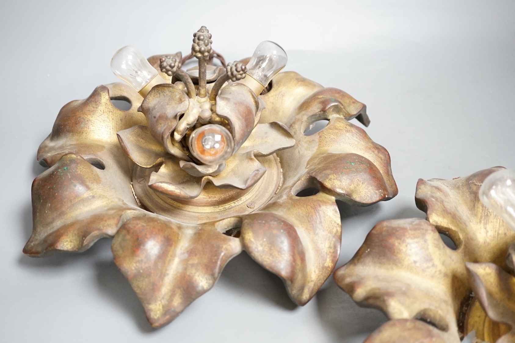 A pair of early 20th century gilt bronze flower head lights, 32cm, Will sit flat on a table possibly once ceiling mounted
